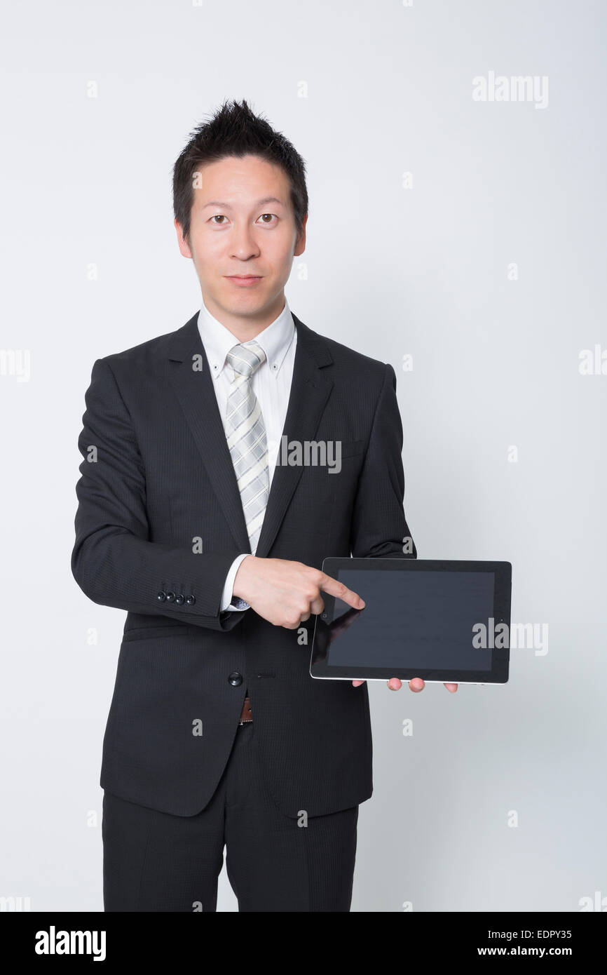 Imprenditore Azienda Computer tablet Foto Stock