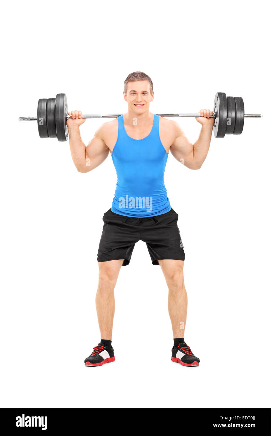A piena lunghezza Ritratto di un atleta che esercitano con un peso pesante isolati su sfondo bianco Foto Stock