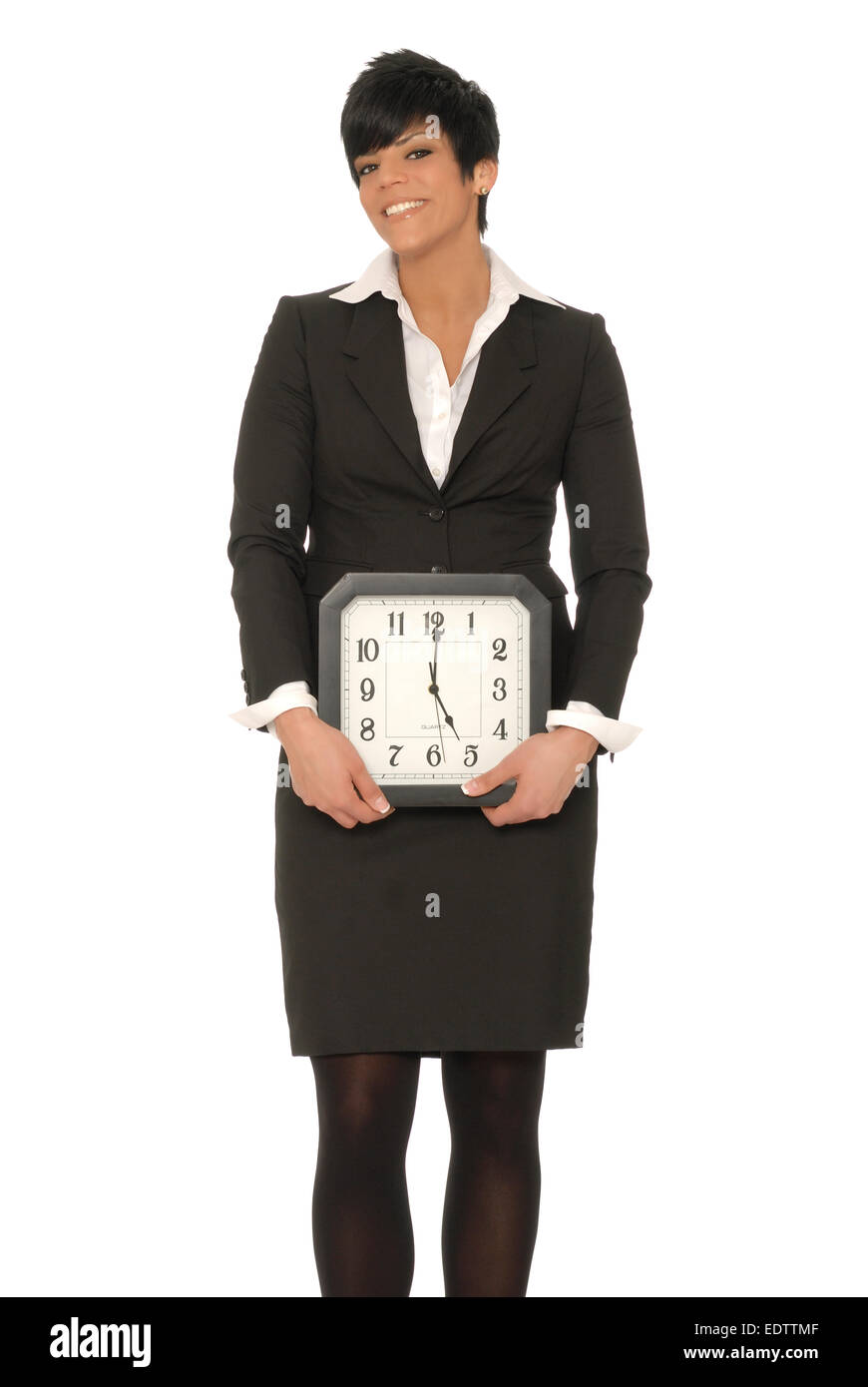 Business donna tenendo un clic che legge ore 5. Può rappresentare la mattina molto presto 5am o uscire da tempo in un 9 a 5 lavoro. Foto Stock
