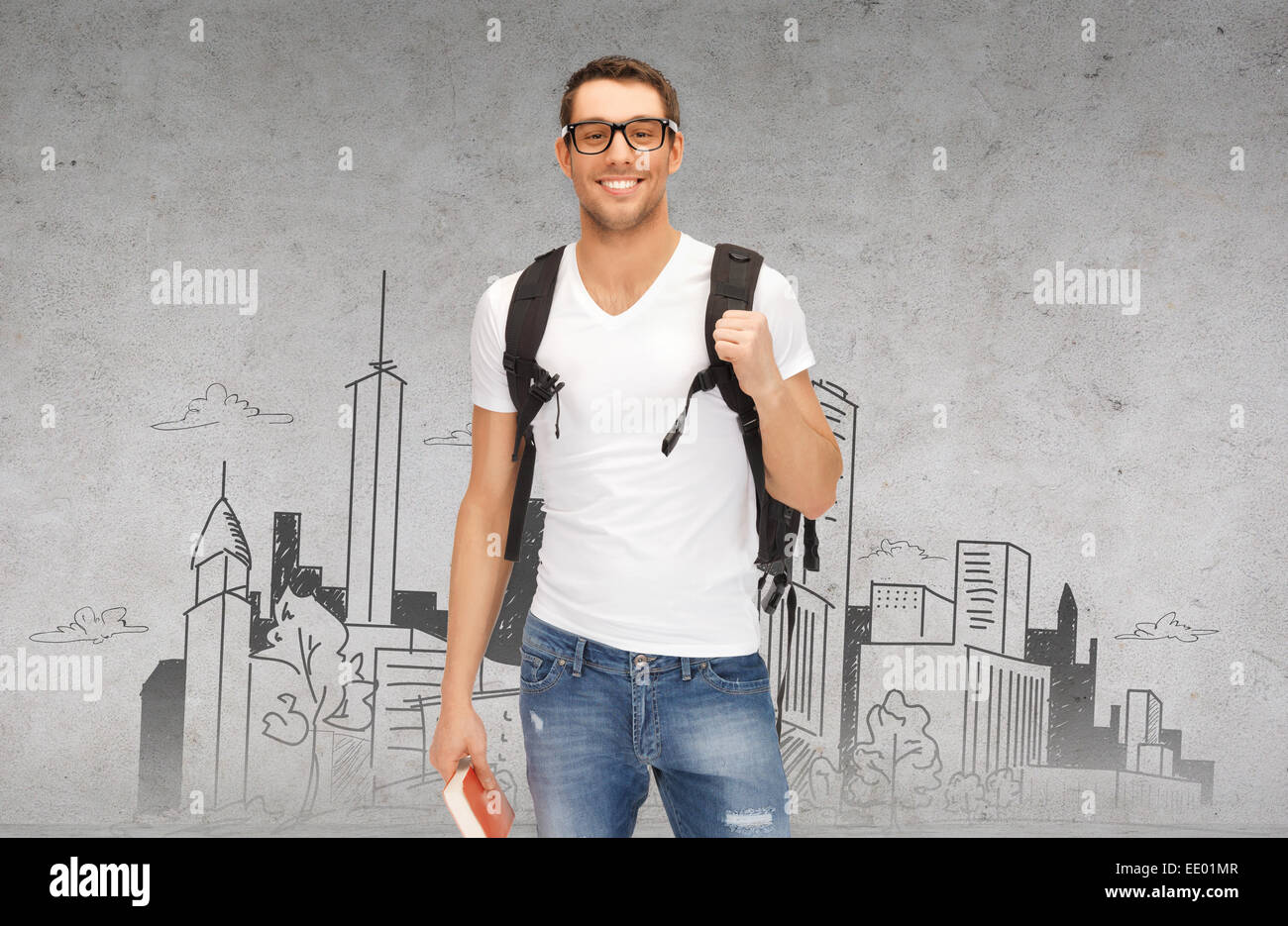 Studente sorridente con zaino e prenota Foto Stock