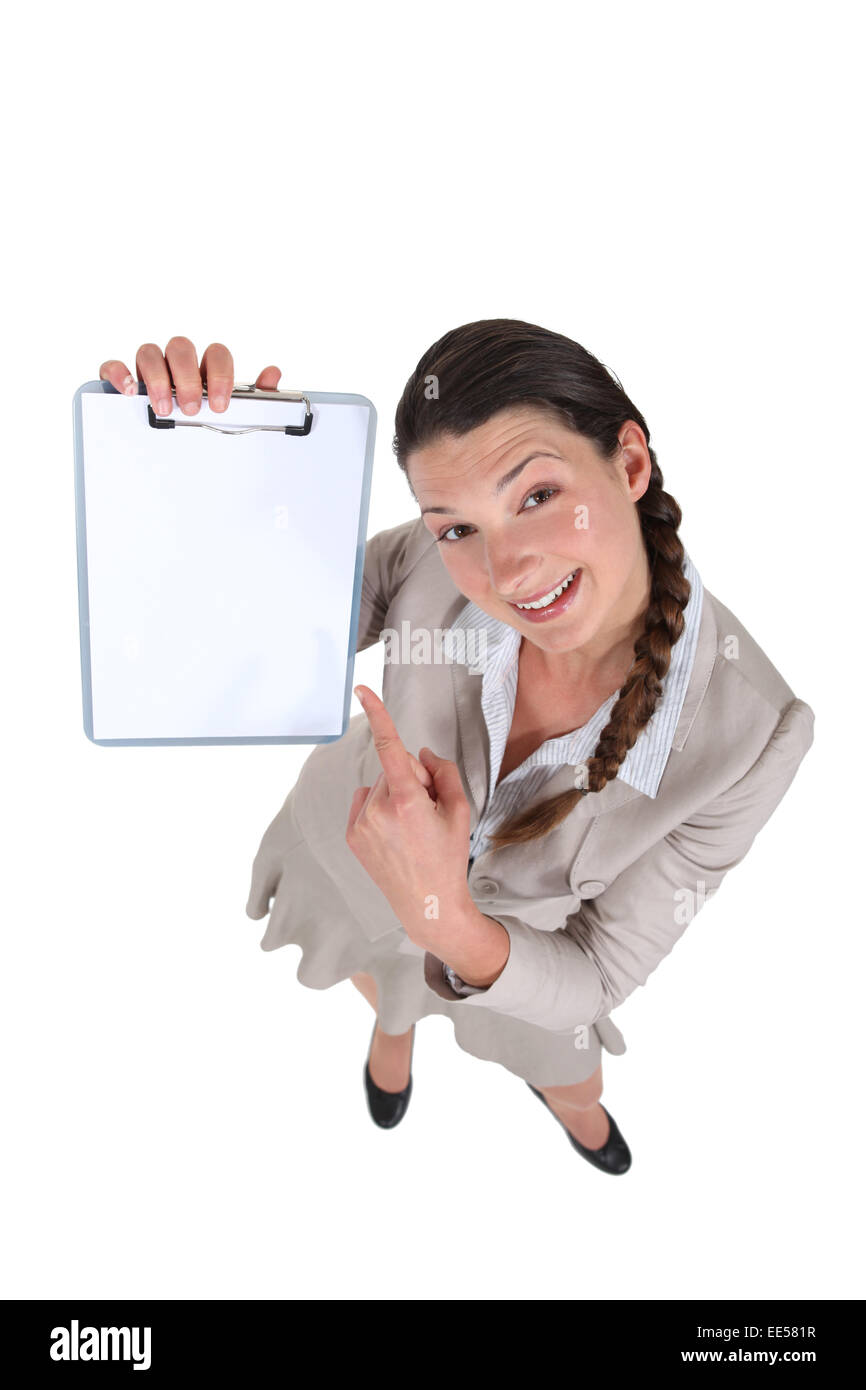 Imprenditrice puntando al suo negli appunti. Foto Stock