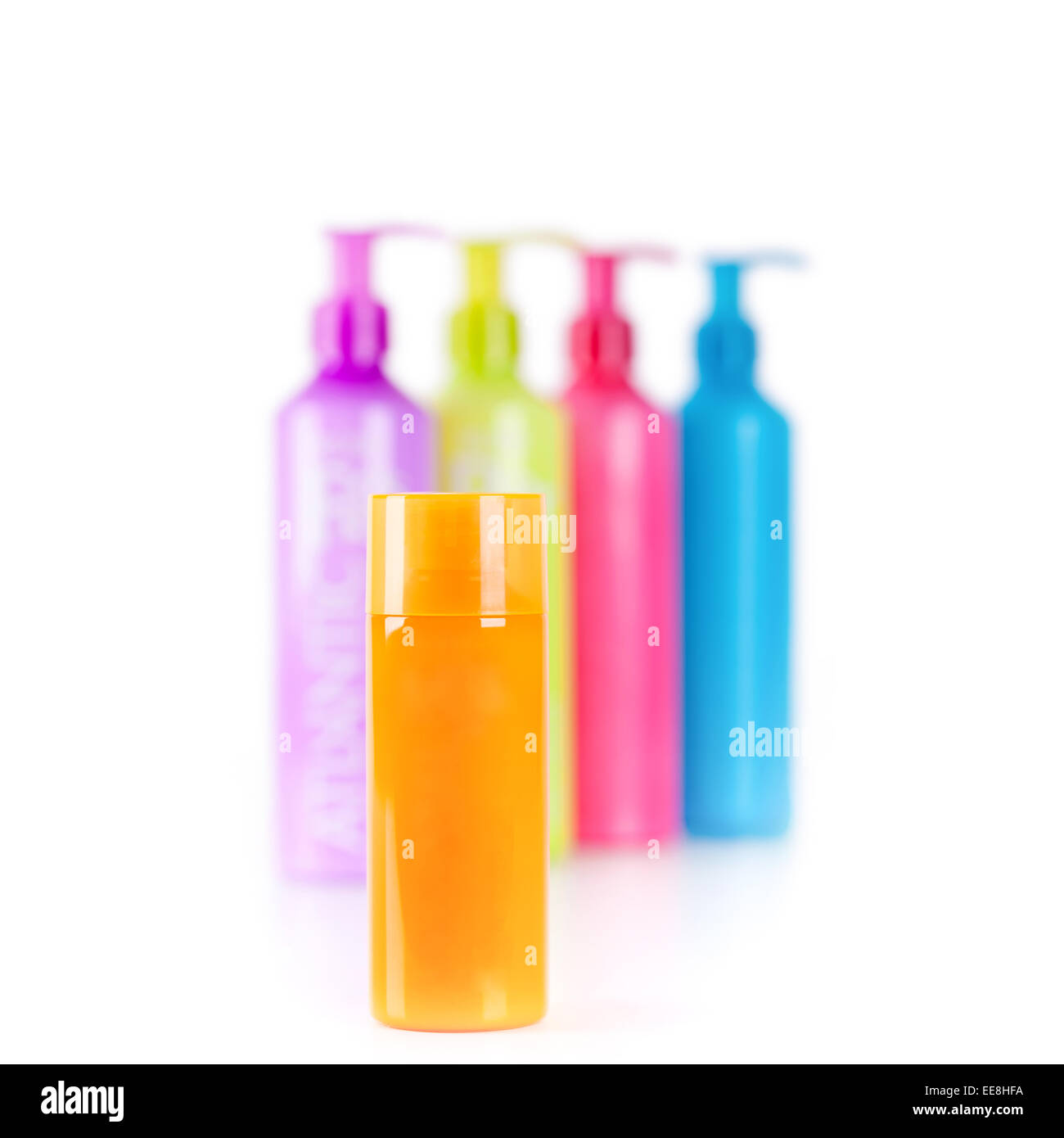 Neon multicolore lozione bottiglie con pompa erogatrice Foto Stock