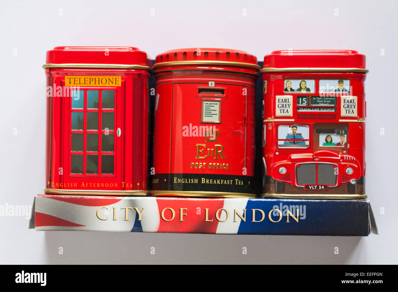 City of London barattoli da tè - bus rosso a due piani, telefono box e post box isolati su sfondo bianco Foto Stock