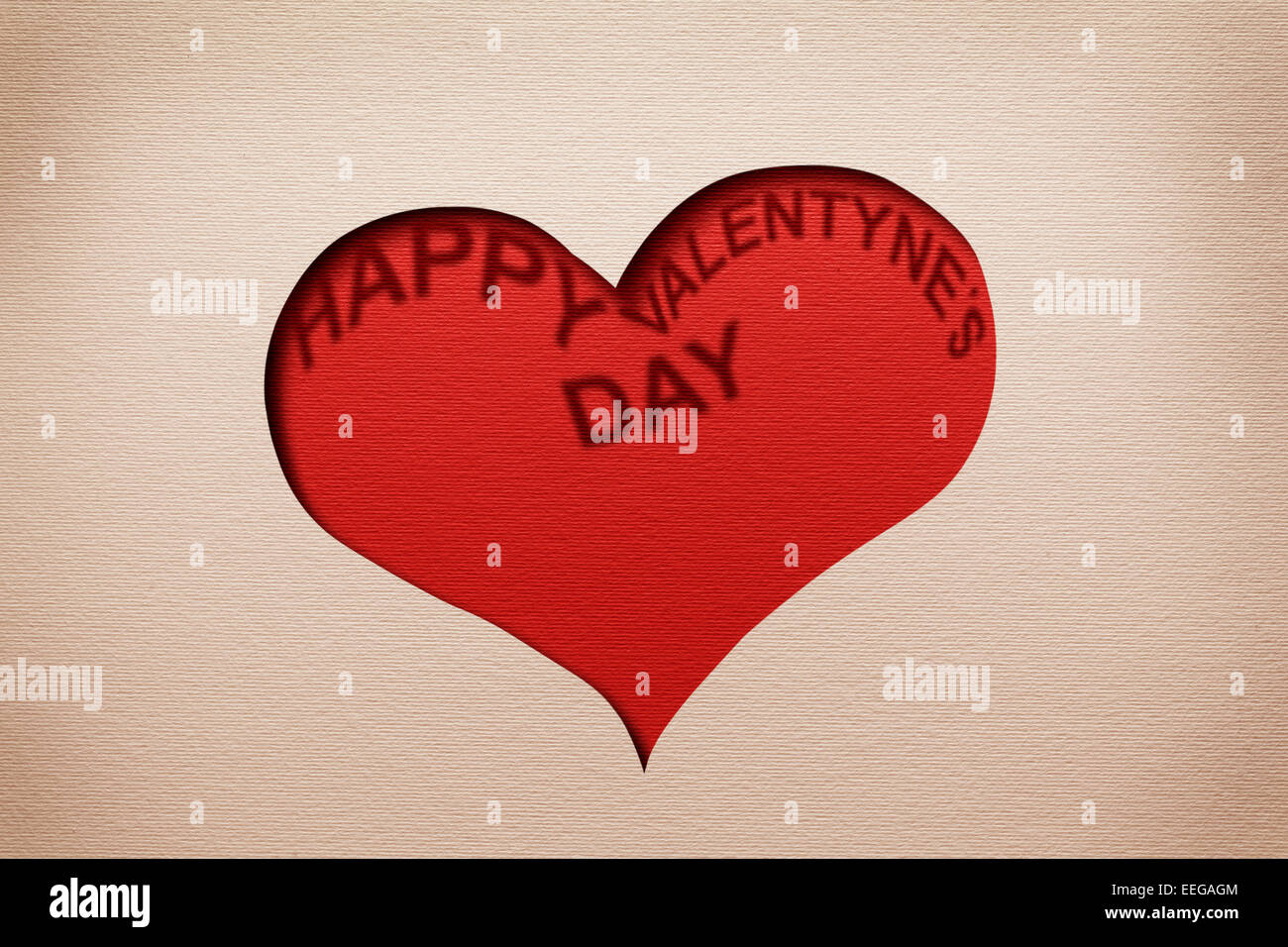 Due cuori nella sfinestratura della carta con parole " Buon San Valentino' all'interno. Foto Stock