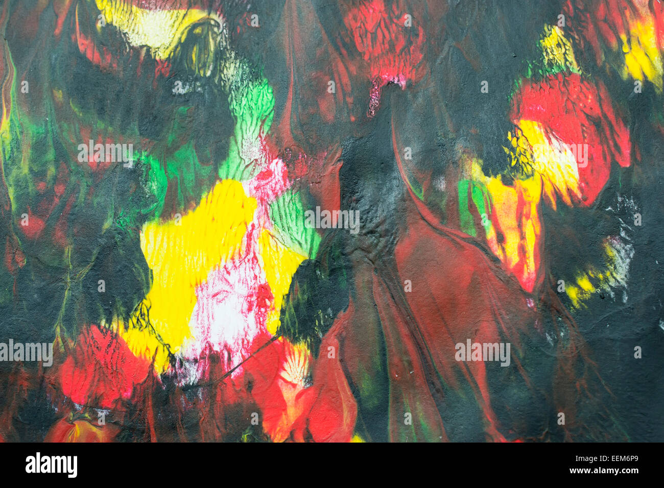 Vari colori acrilici miscelati e cosparso di un abstract background artistico Foto Stock