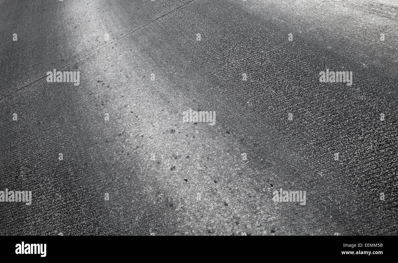Dark urban strada asfaltata foto di sfondo texture Foto Stock