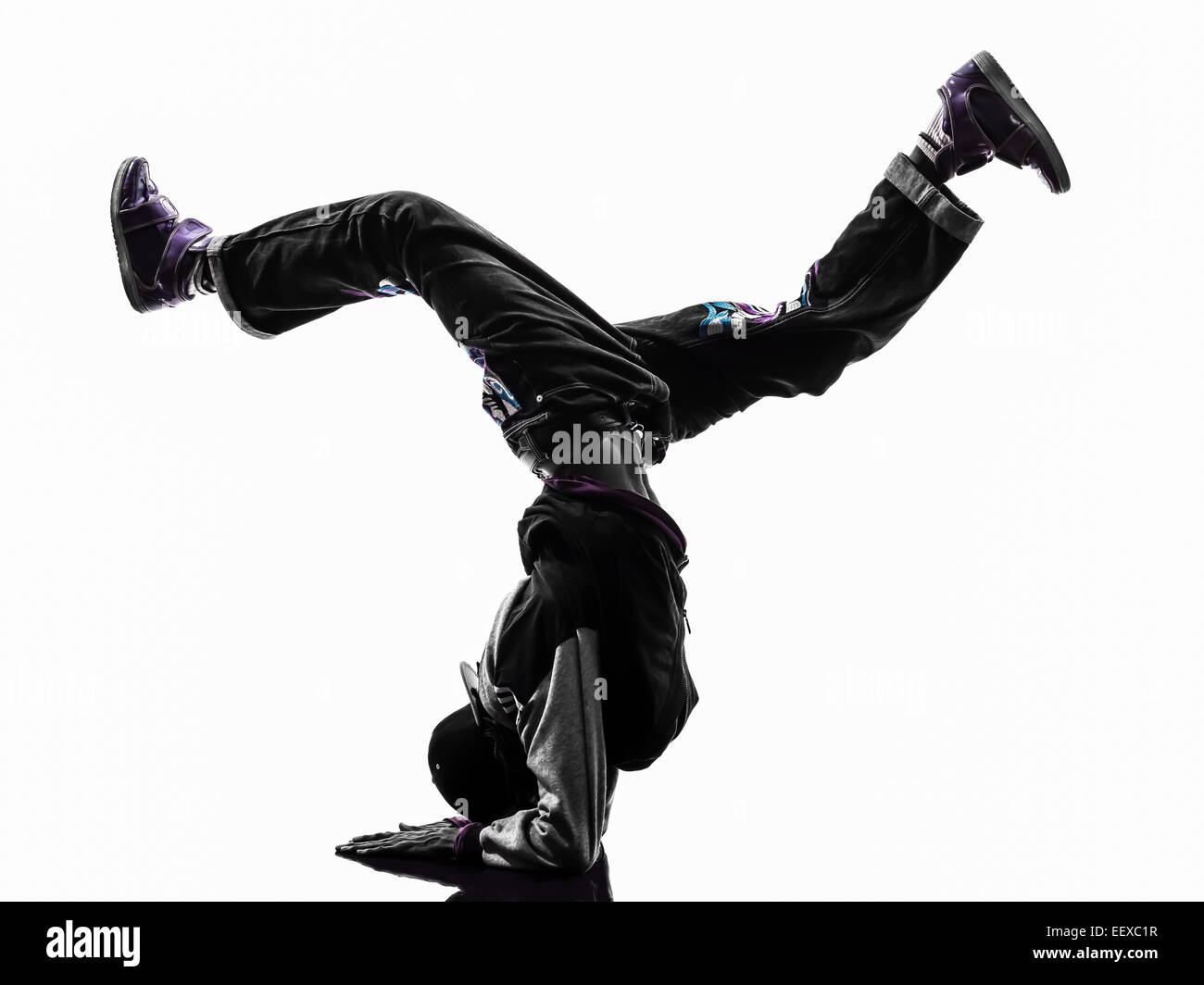 Un hip hop acrobatico ballerino break breakdance giovane handstand silhouette sullo sfondo bianco Foto Stock