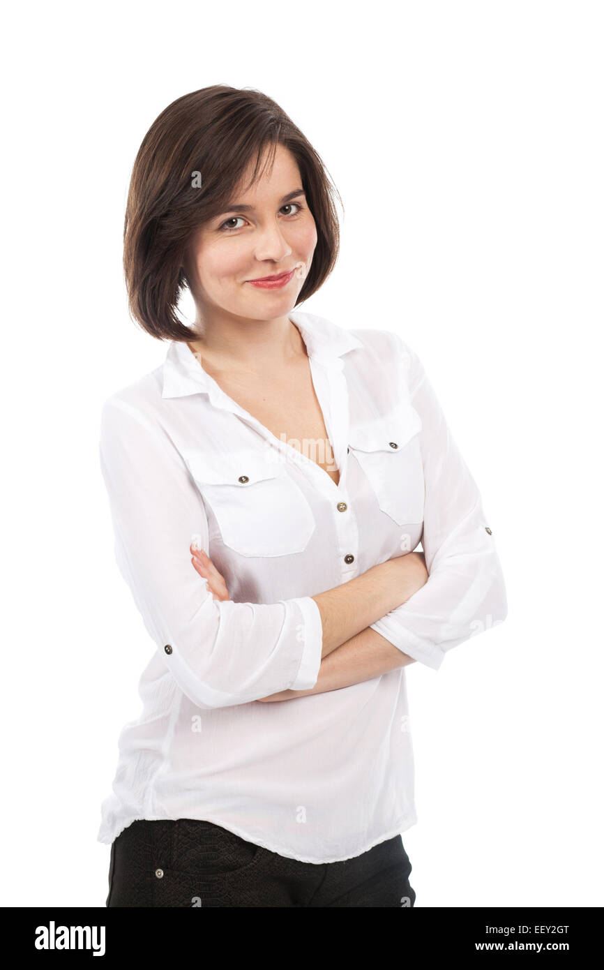 Ritratto di una giovane bruna con le braccia incrociate, isolato su bianco Foto Stock