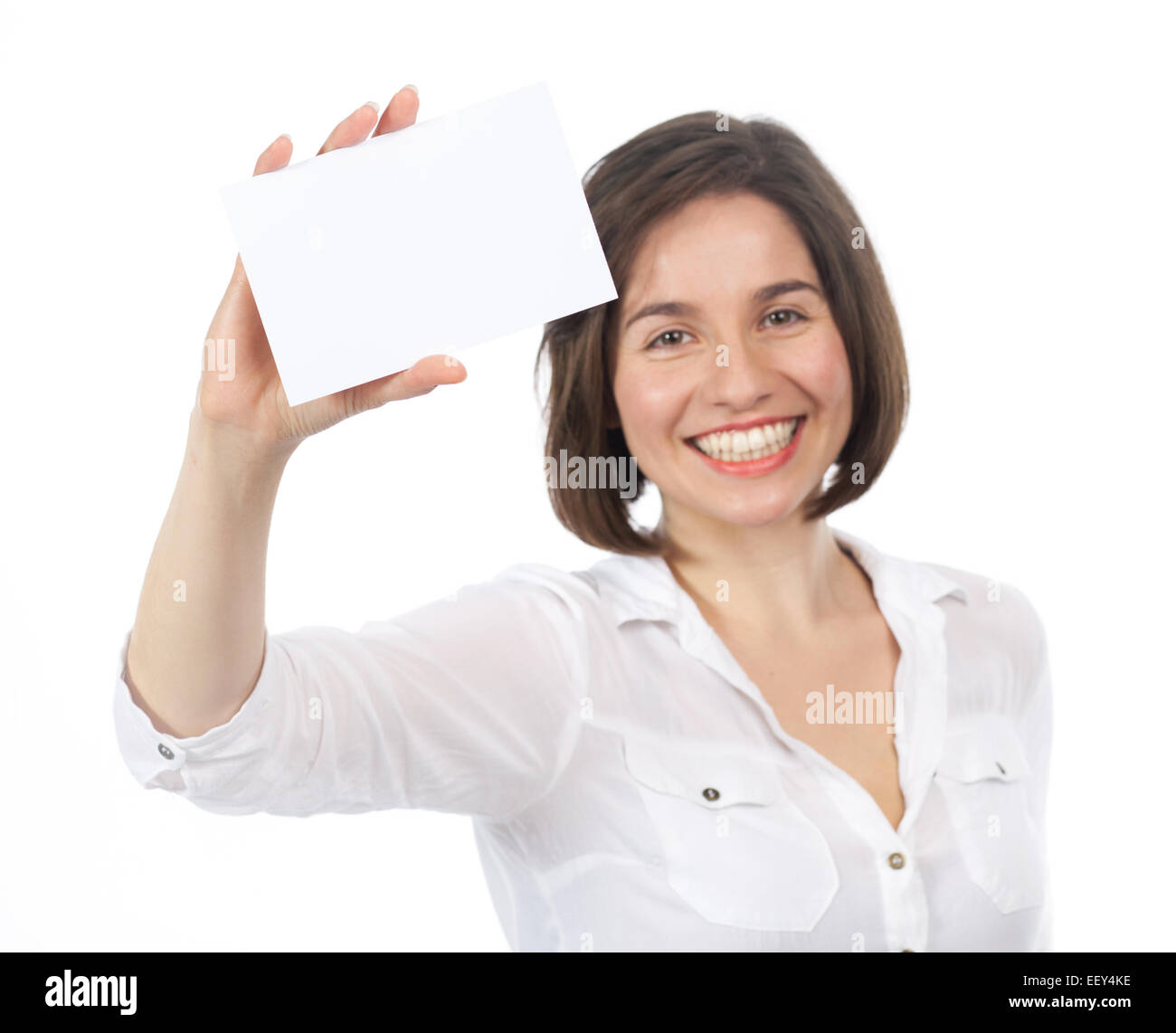 Bella bruna presentando un cartello bianco nel carattere del suo, isolato su bianco Foto Stock