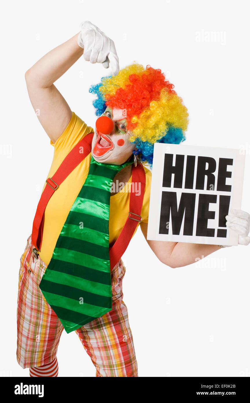 Clown tenendo un noleggio mi segno Foto Stock