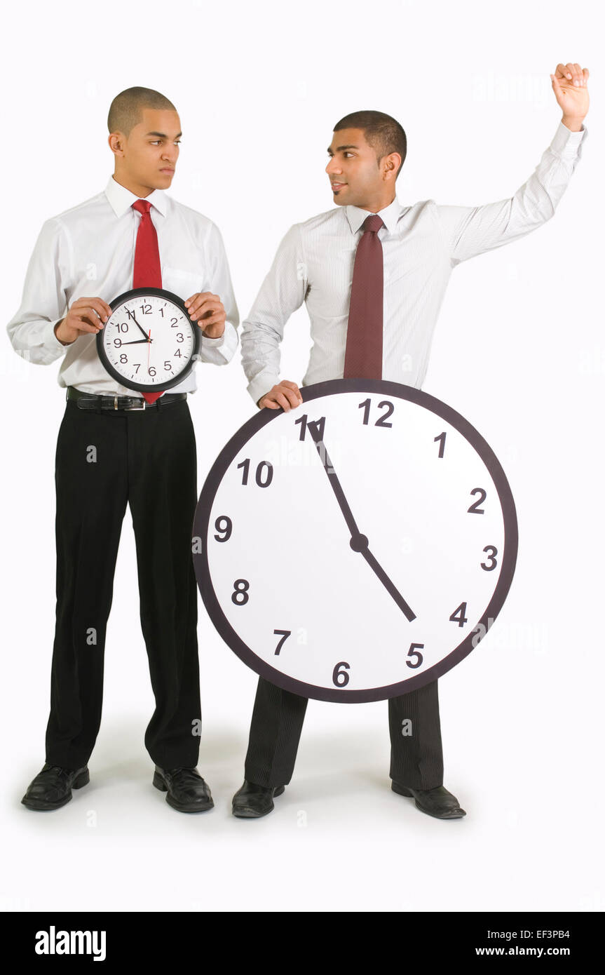 Imprenditori orologi di contenimento Foto Stock