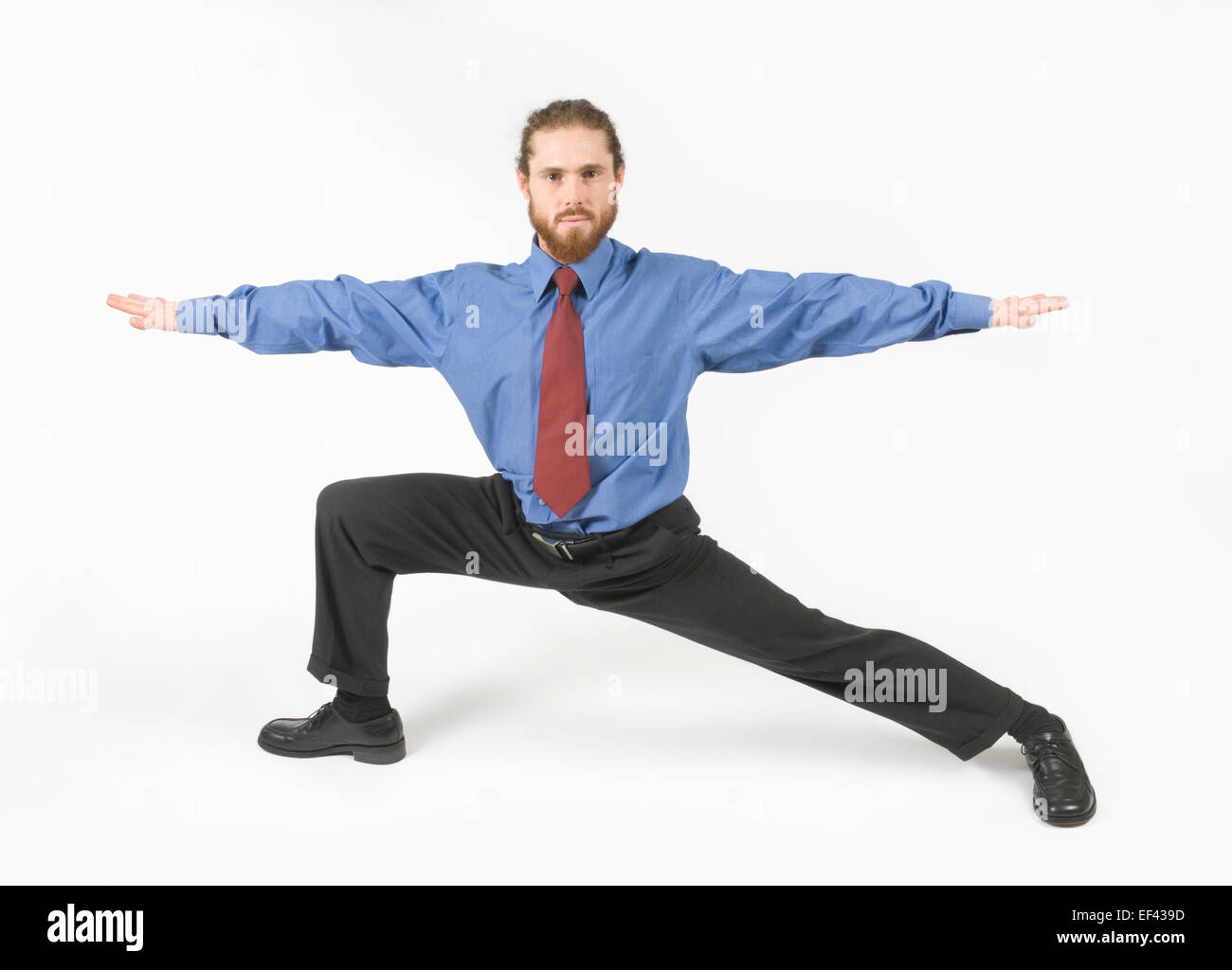 Imprenditore fare yoga Foto Stock