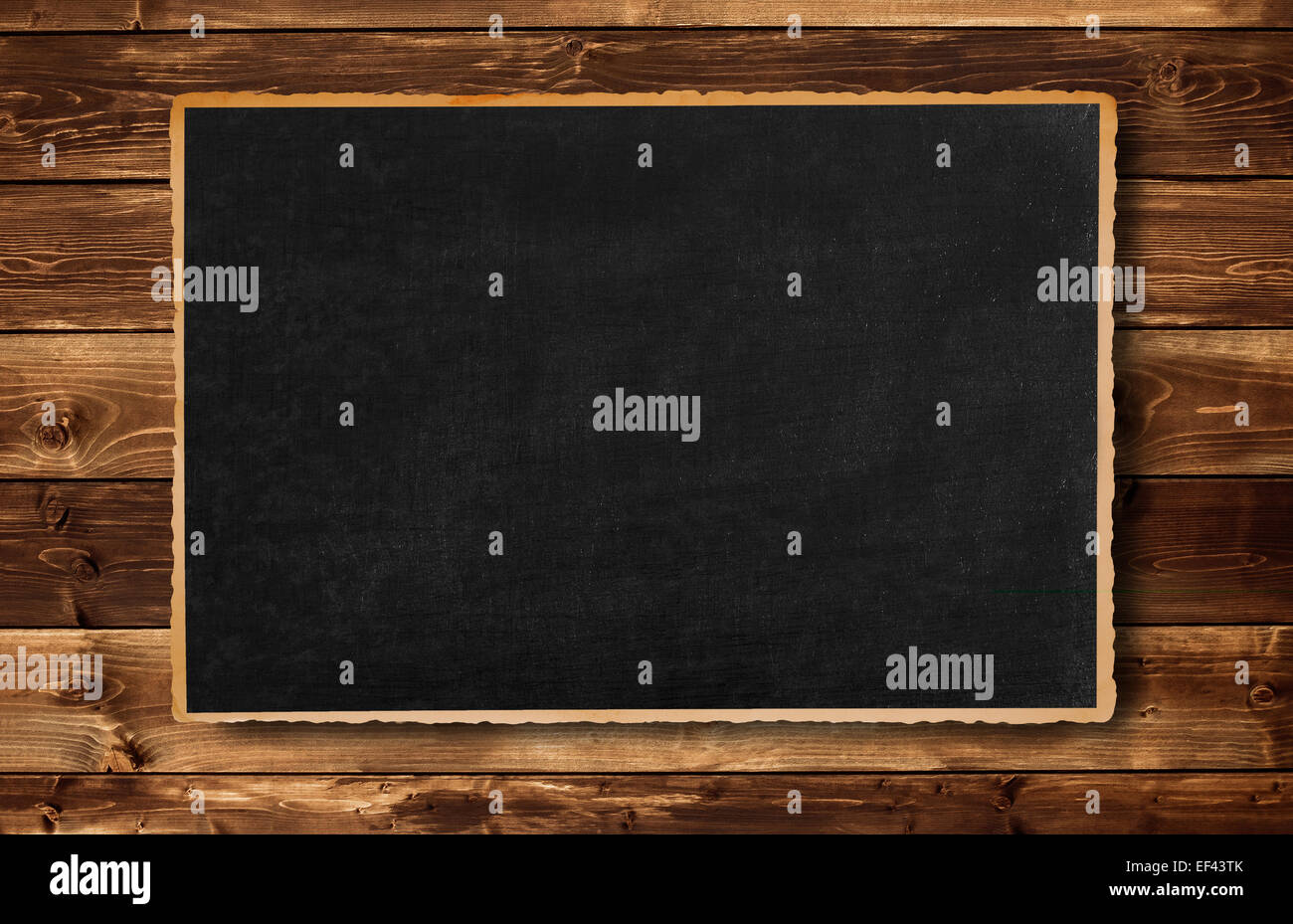 Vecchia cornice immagine su uno sfondo di legno Foto Stock