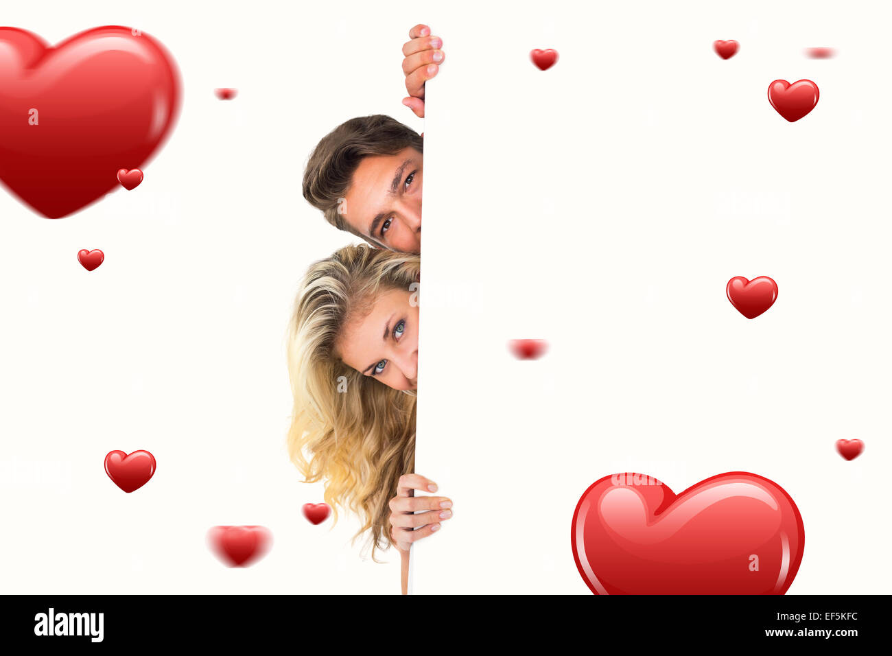 Immagine composita di attraente giovane coppia sorridente in telecamera Foto Stock
