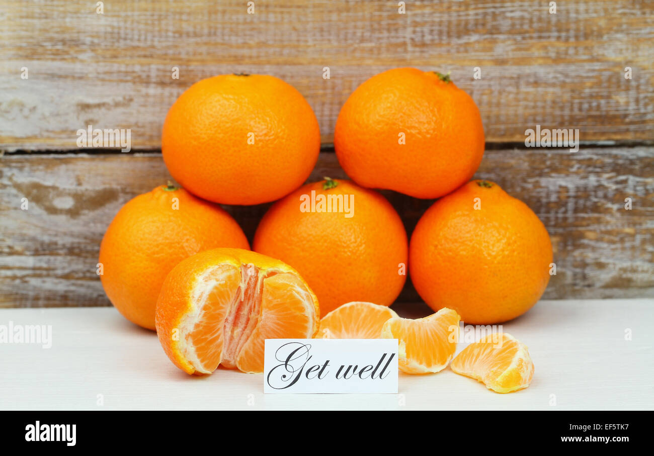 Get Well card con mandarini con legno rustico sfondo Foto Stock