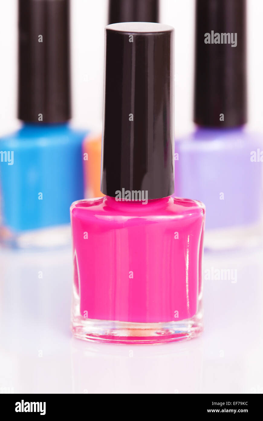 Tre multi-colore di smalto per unghie Foto Stock