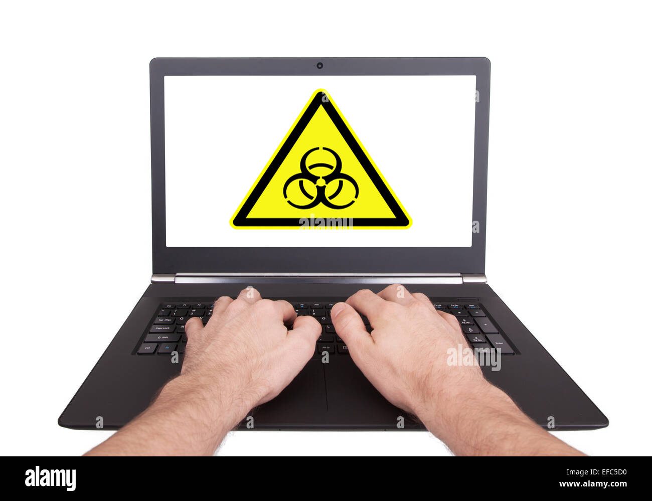 Uomo al lavoro su laptop, rischio biologico, isolato Foto Stock