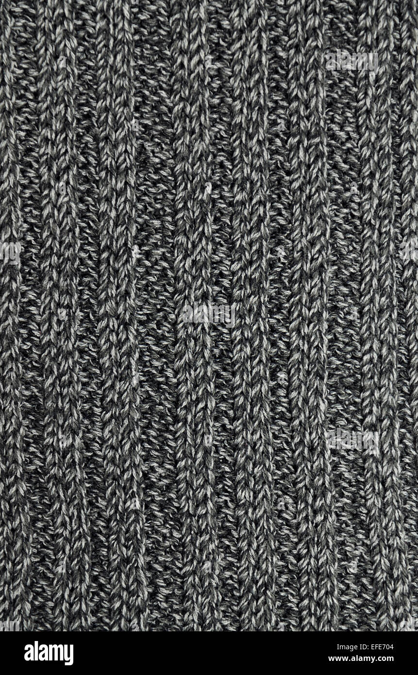 Close up di un antracite, grigio e nero e chiazzata striped scialle a maglia, full frame, verticale Foto Stock