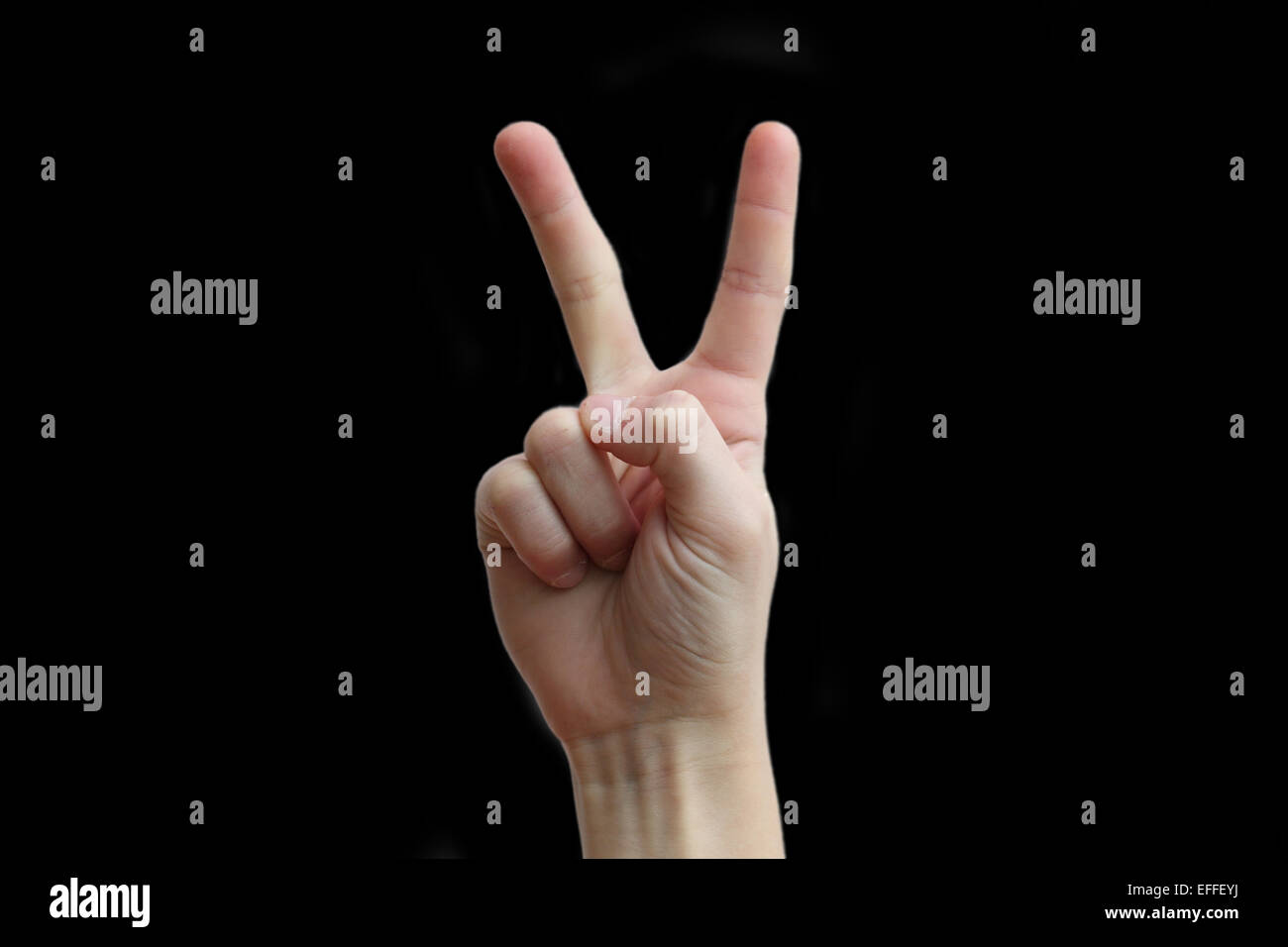 Due dita della mano su uno sfondo nero Foto Stock