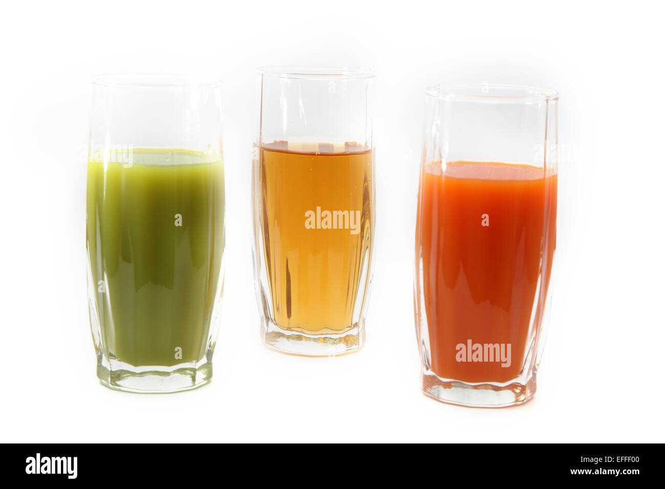 Tre Bicchieri con succo Foto Stock