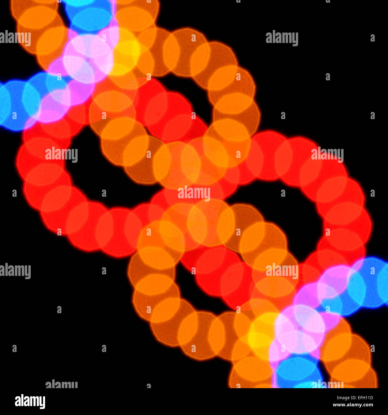 Abstract luci sfocate pattern cerchi colorati su sfondo nero. Foto Stock
