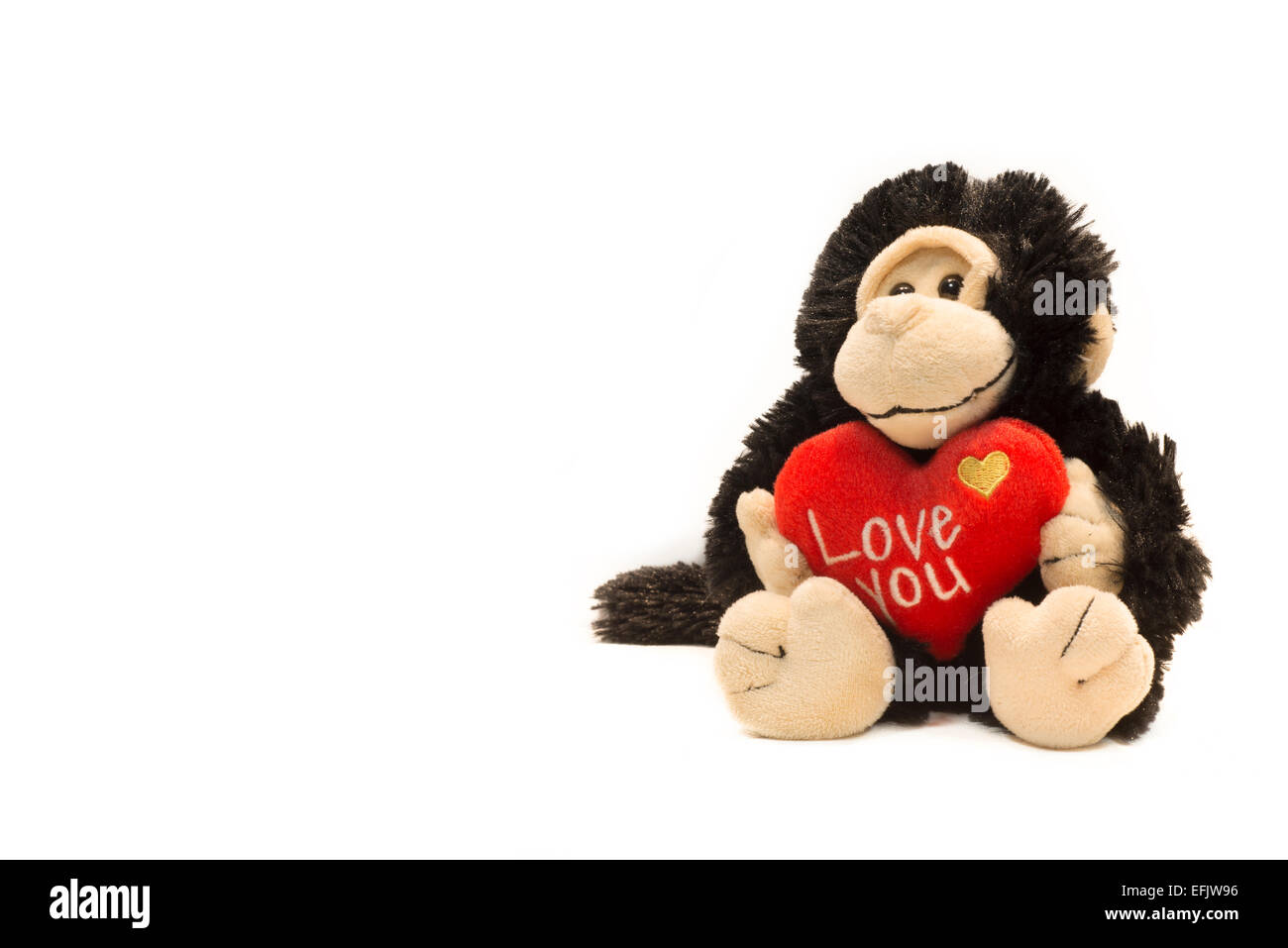 Monkey lussureggiante giocattolo con I Love U segno Foto Stock