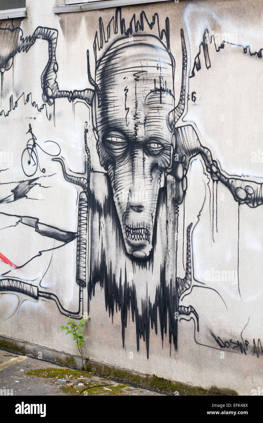 Il male cerca di fronte street art graffiti a Bristol Foto Stock