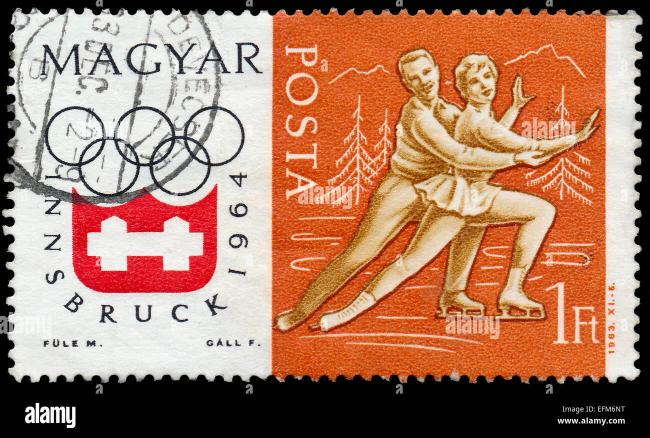 Ungheria - circa 1963: un timbro stampato in Ungheria mostra la figura pattinare, coppia, inverno sport olimpici, Innsbruck 64, circa 1963 Foto Stock