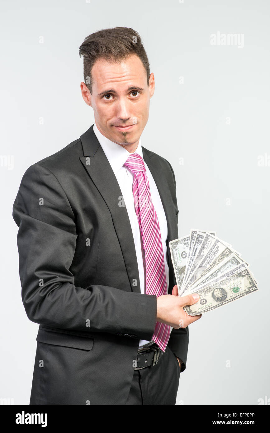 Imprenditore tenendo un sacco di soldi Foto Stock