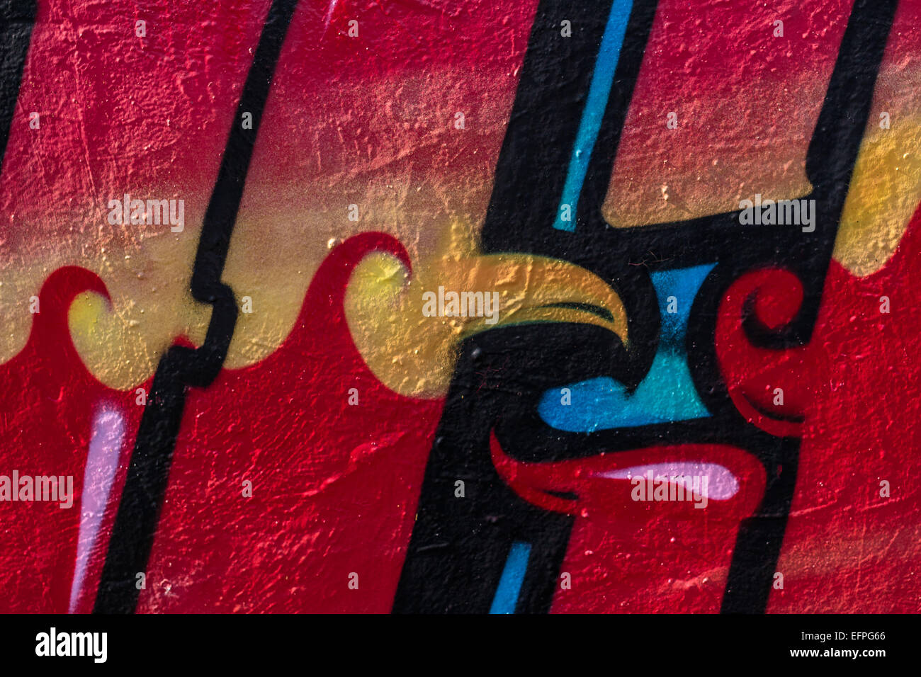 La vibrante spraycan art su una parete in cemento. Foto Stock