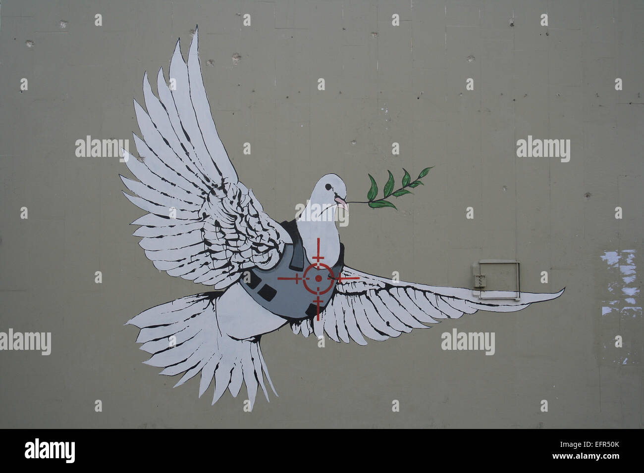 Artisti di graffiti commentare le prospettive per la pace a Betlemme Foto Stock