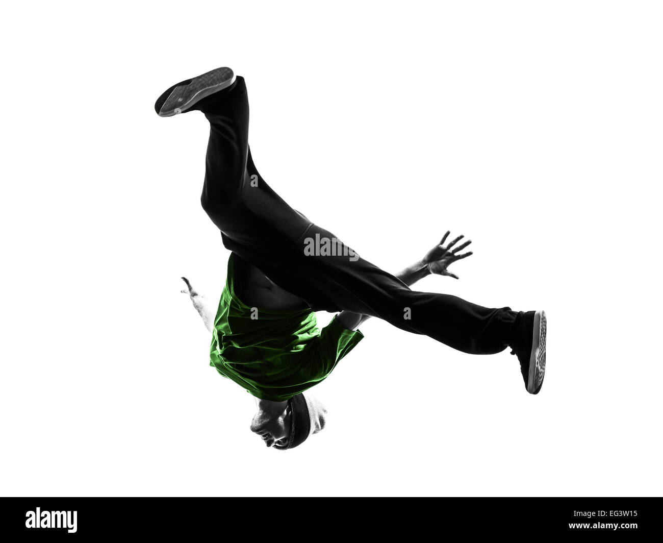 Un giovane acrobatico ballerino break breakdance uomo in silhouette sullo sfondo bianco Foto Stock