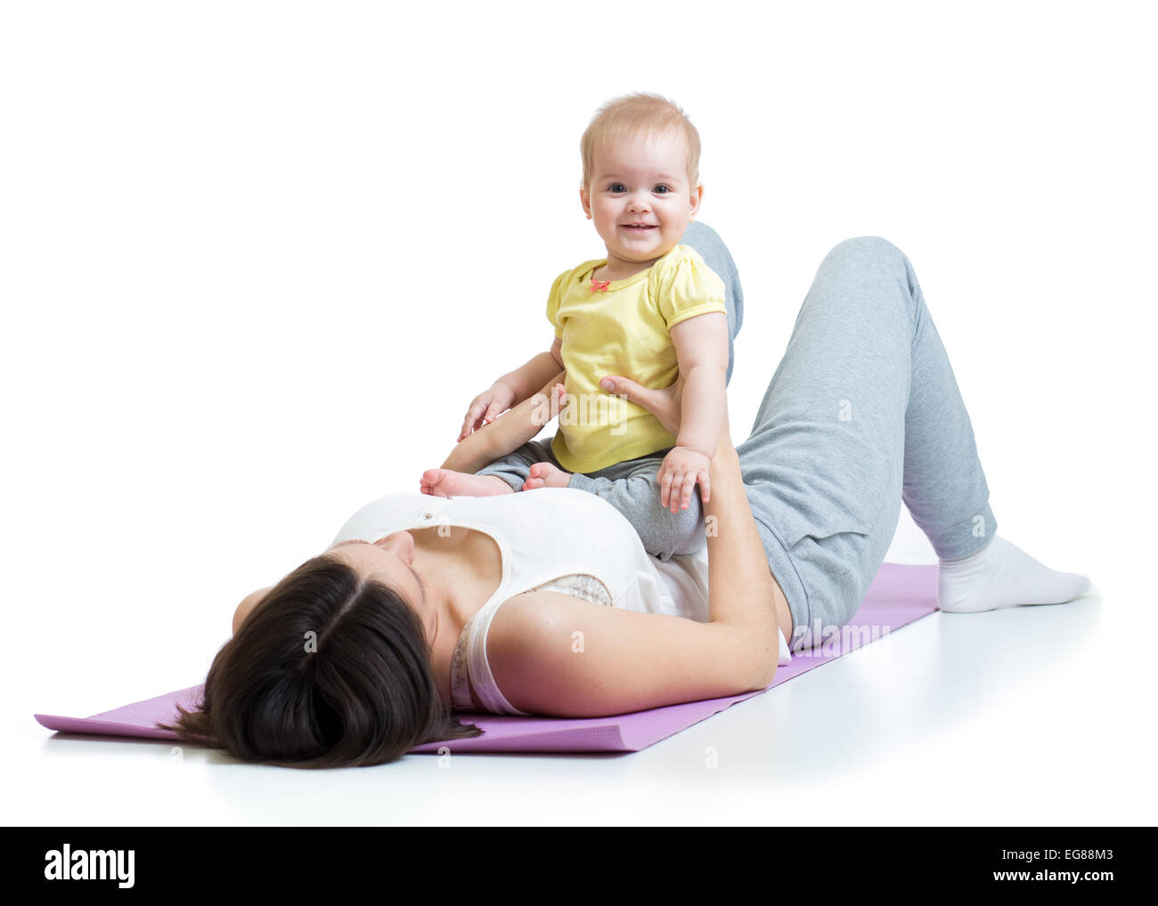 Madre con bambino fare ginnastica e esercizi di fitness Foto Stock