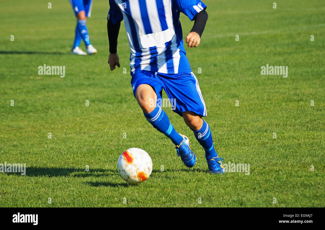 Giocatore di calcio con una palla Foto Stock