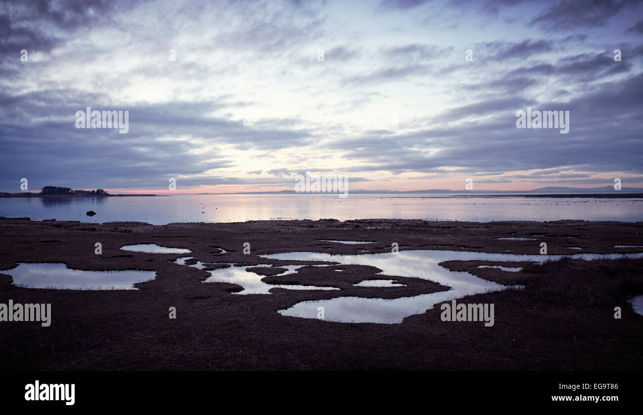 Ultimo della luce della sera impostazione in al mare Foto Stock