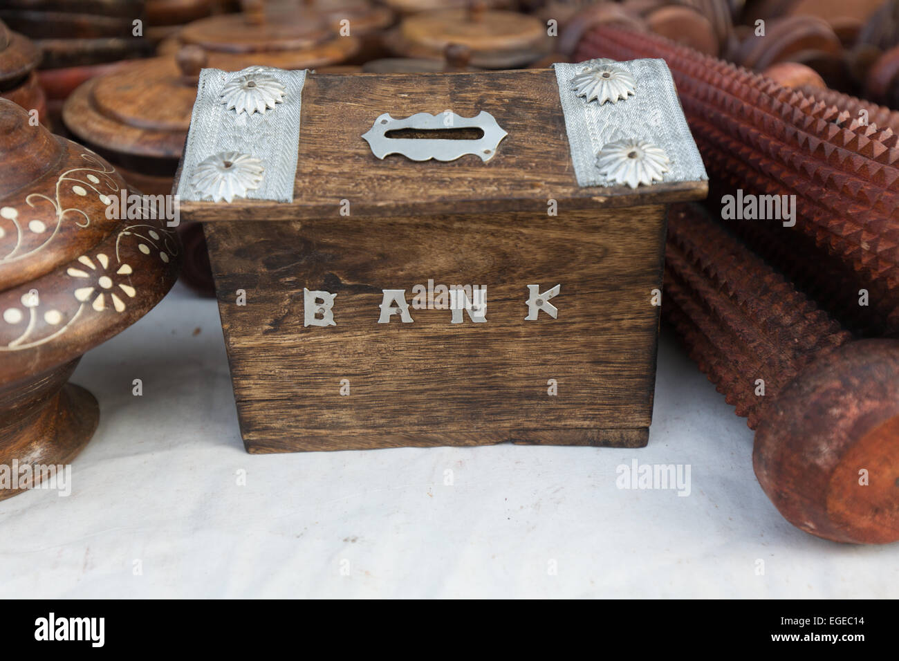 Legno banca di monete Foto Stock