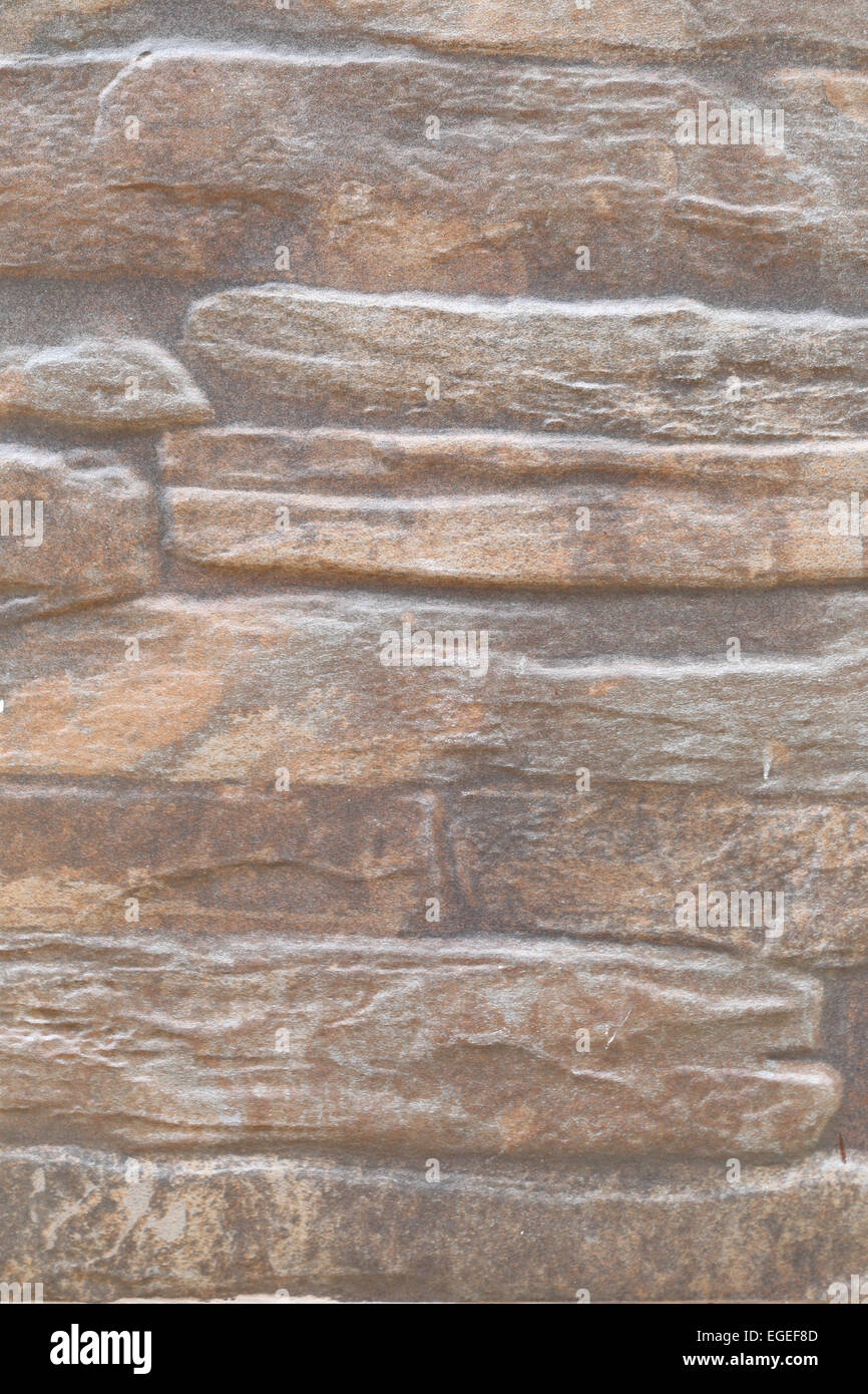 Marrone irregolare la superficie della pietra per lo sfondo. Foto Stock