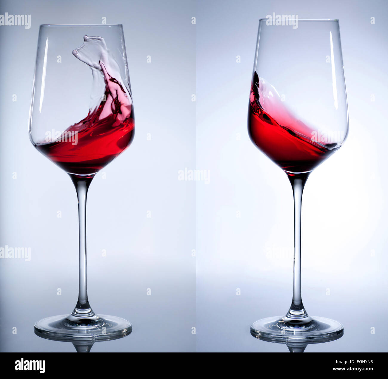 Vino rosso schizzi in elegante vetro. Foto Stock