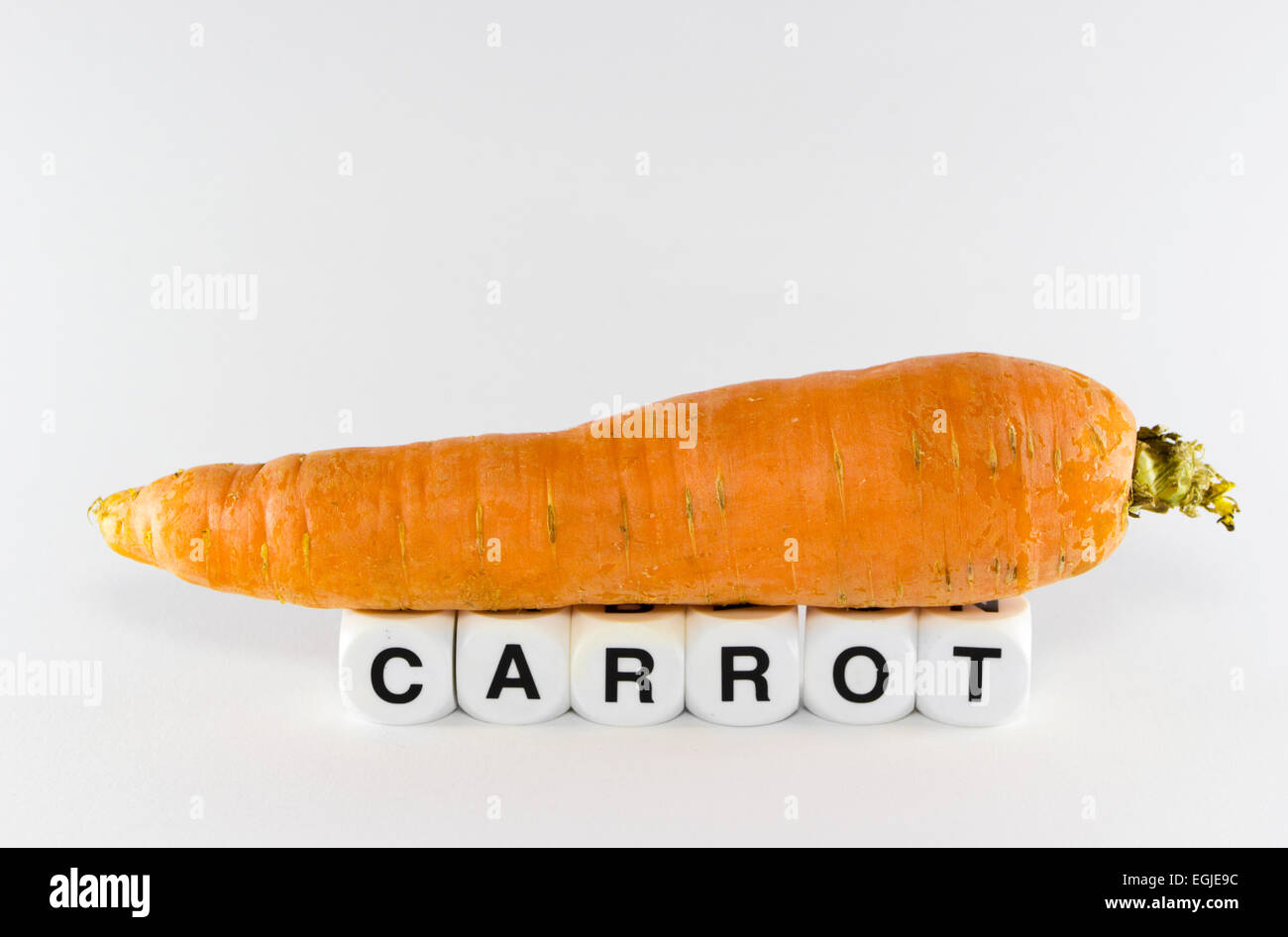 La carota su sfondo bianco Foto Stock