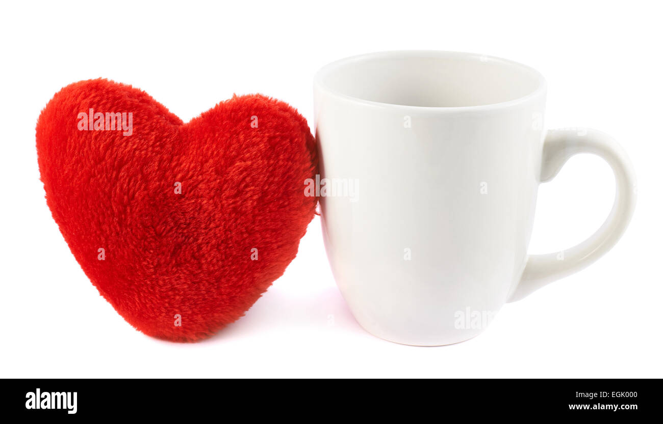 Tazza bianca accanto ad un cuore rosso Foto Stock