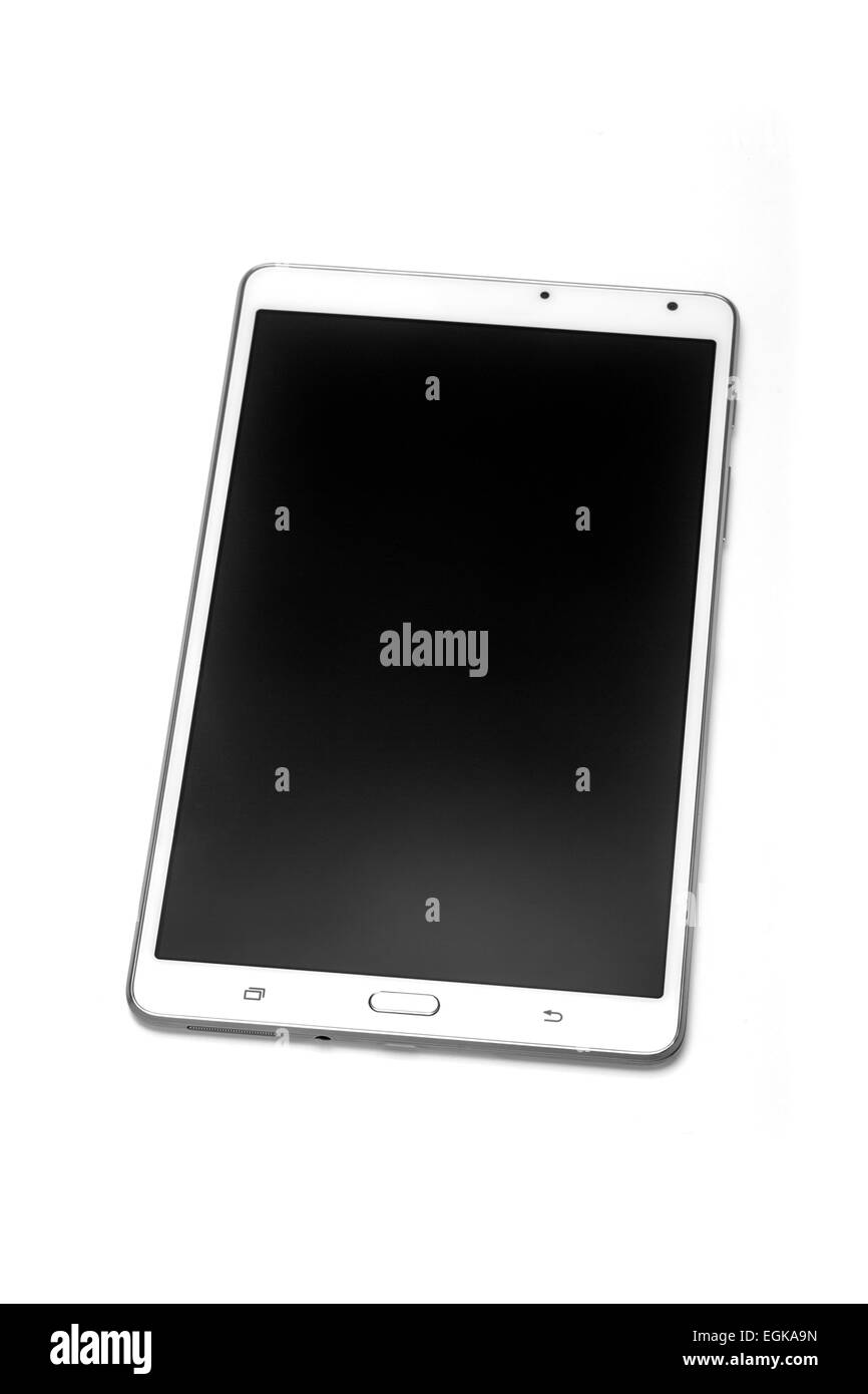 Un tocco di tablet fotografato in studio su uno sfondo bianco. Tablette photographiée tattile en studio sur fond blanc. Foto Stock