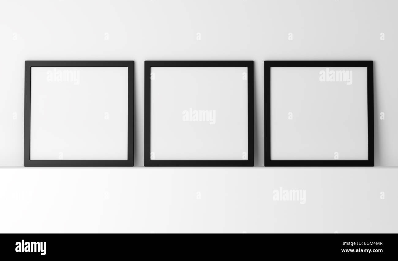 Tre nero vuota photo frame sullo scaffale bianco Foto Stock