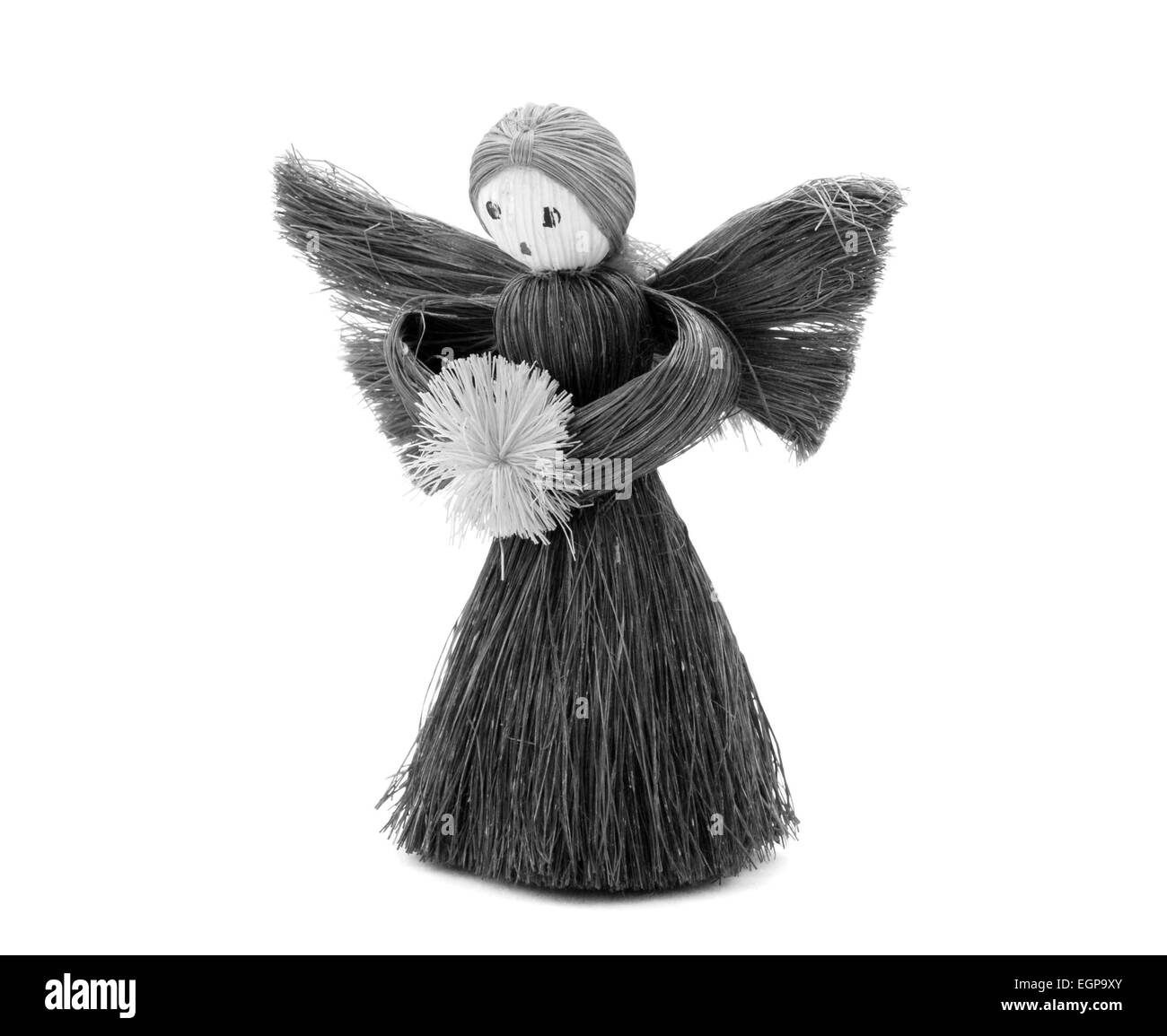 Christmas Angel tree decorazione realizzata da paglia, isolato su uno sfondo bianco - elaborazione monocromatica Foto Stock