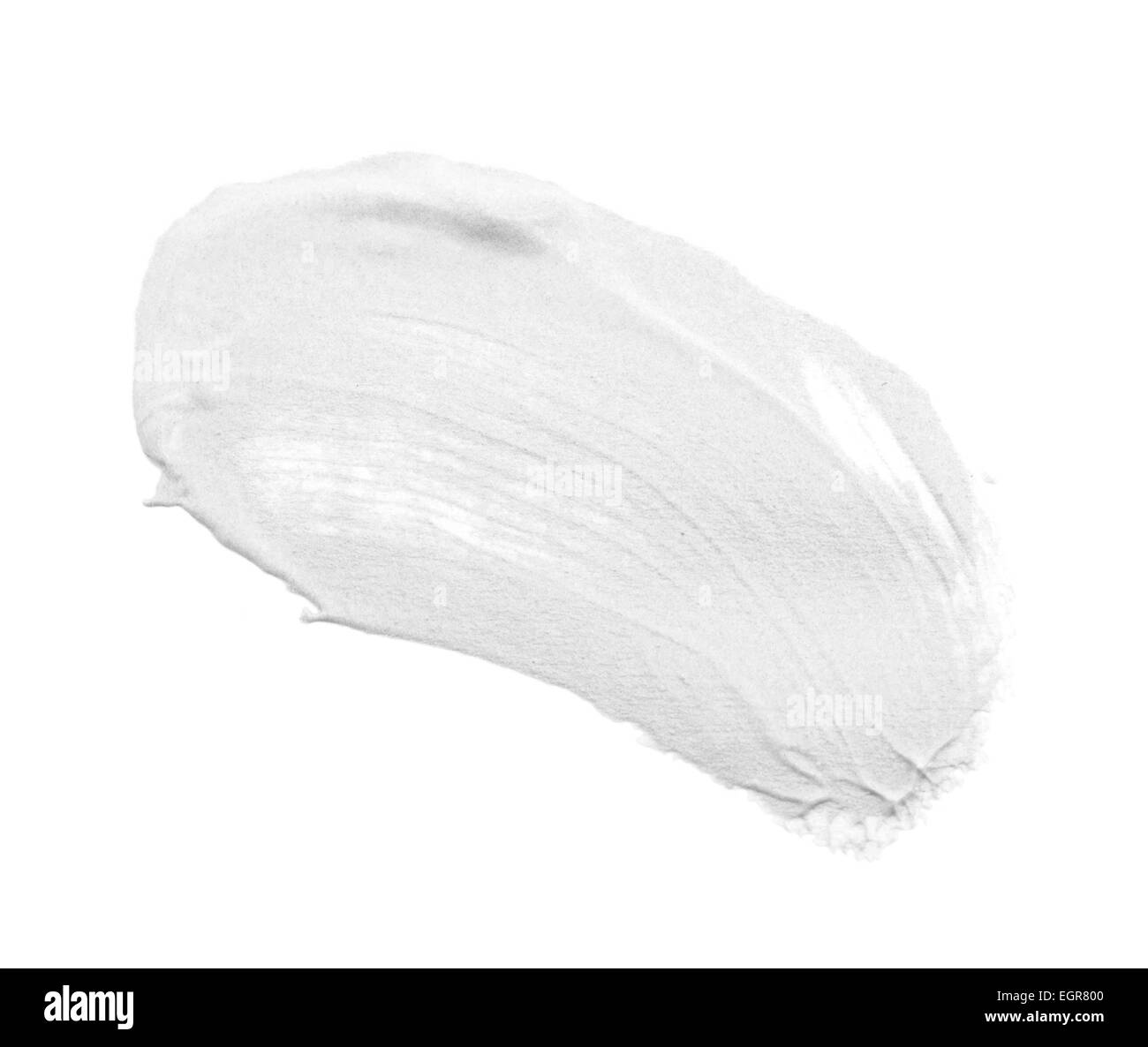 Cospargere di vernice o di crema isolato su sfondo bianco Foto Stock