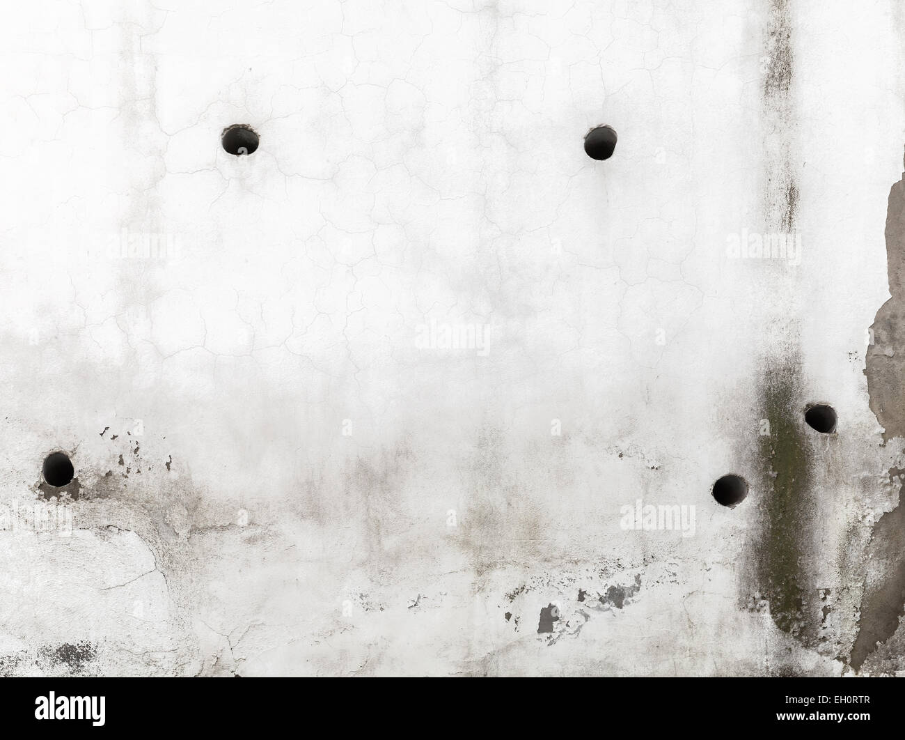 Closeup texture di sfondo bianco di un muro di cemento con fori Foto Stock