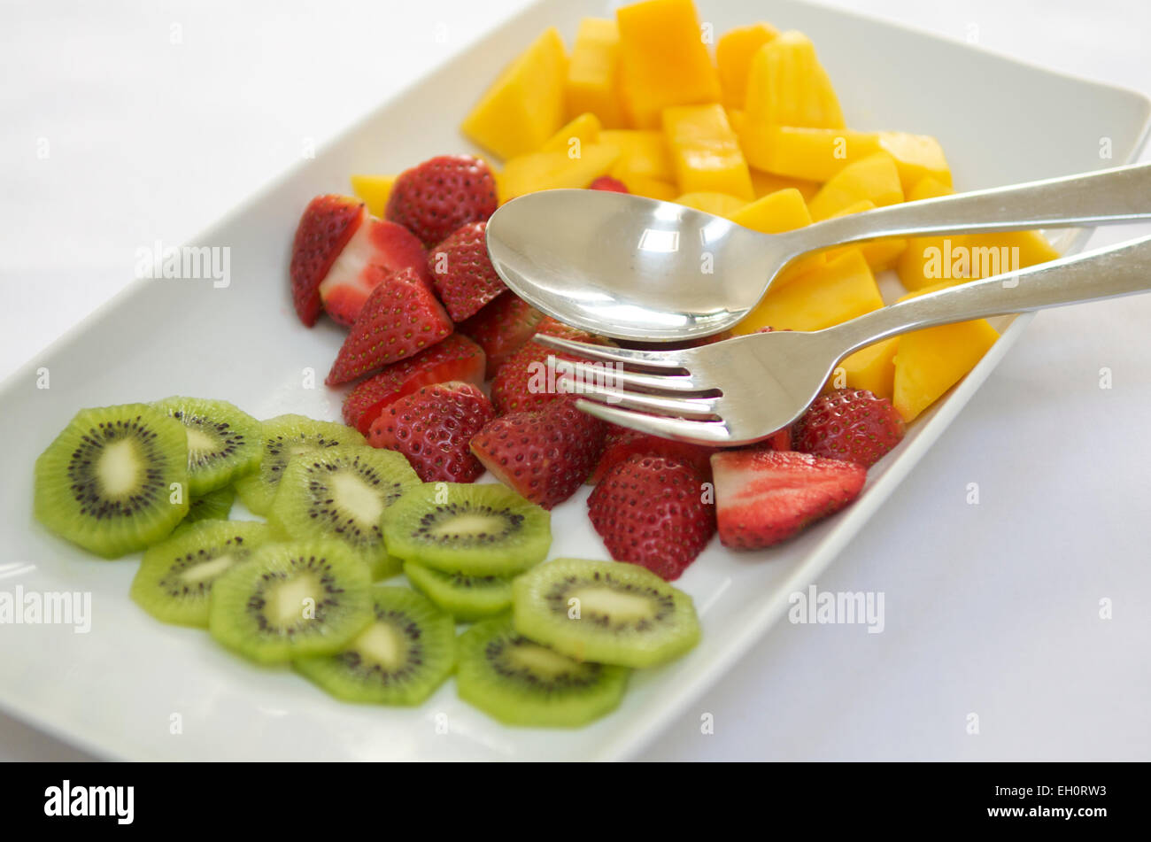 Una selezione di frutta fresca a colazione Foto Stock