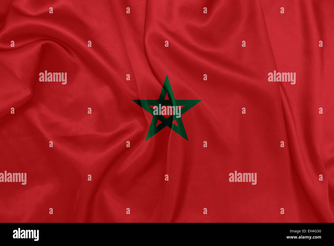 Marocco - sventola bandiera nazionale sulla tessitura della seta Foto Stock
