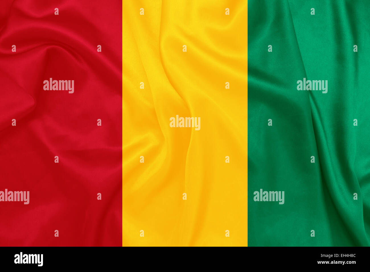 Guinea - sventola bandiera nazionale sulla tessitura della seta Foto Stock