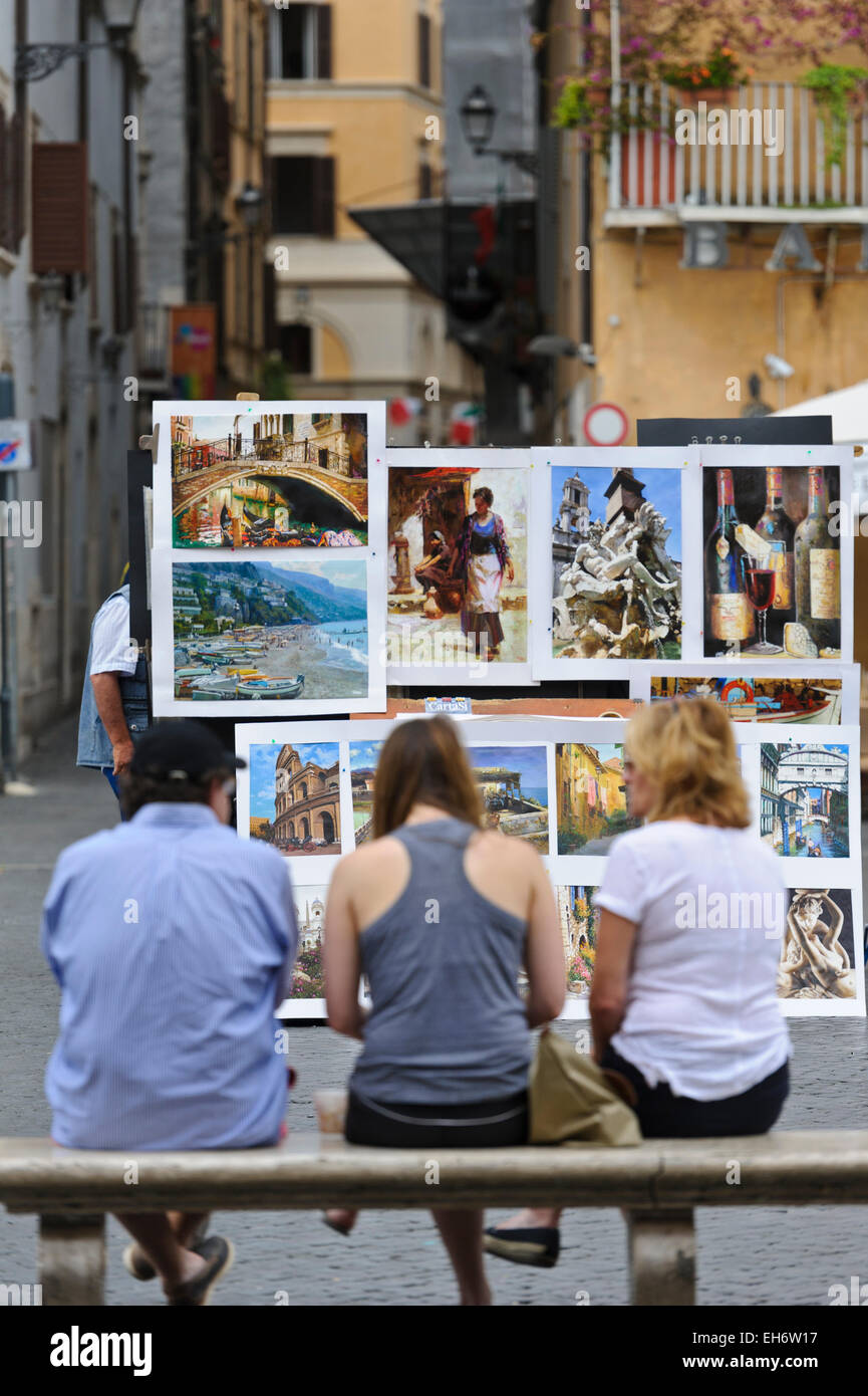 La pittura italiana sul display per la vendita in una piazza di Roma, Italia. Foto Stock