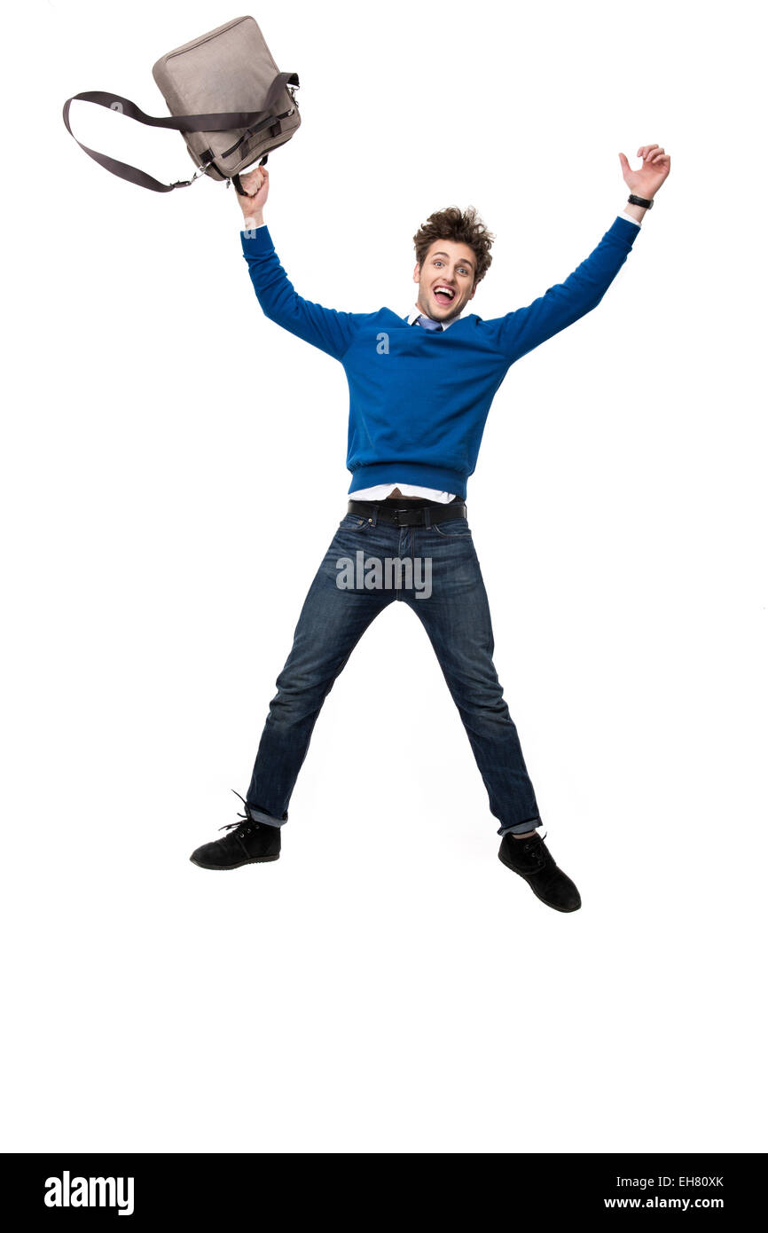 Ridendo business man jumping con borsa su sfondo bianco Foto Stock